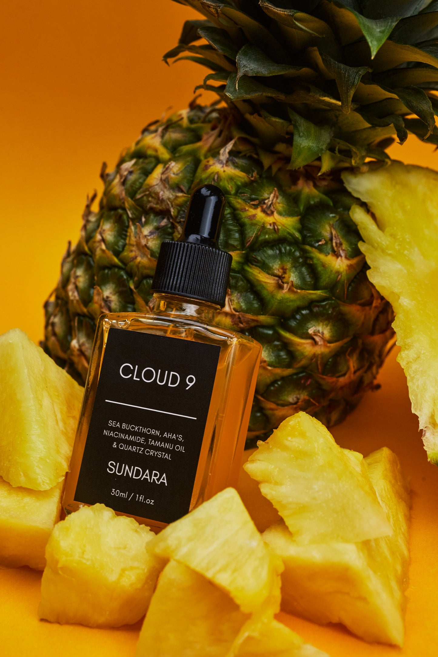 Cloud 9 Sundara product with a pineapple on an orange background