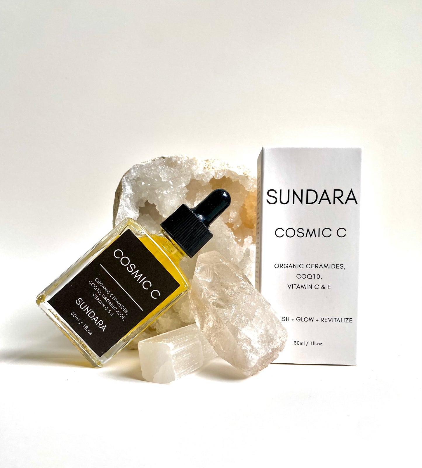 Soul of Sundara Cosmic C Serum on Quartz Crystal. Organic skincare, Ceramides, CoQ10, Organic Aloe, Vitamin C, Vitamin E brightening serum for acne and hyperpigmentation.
