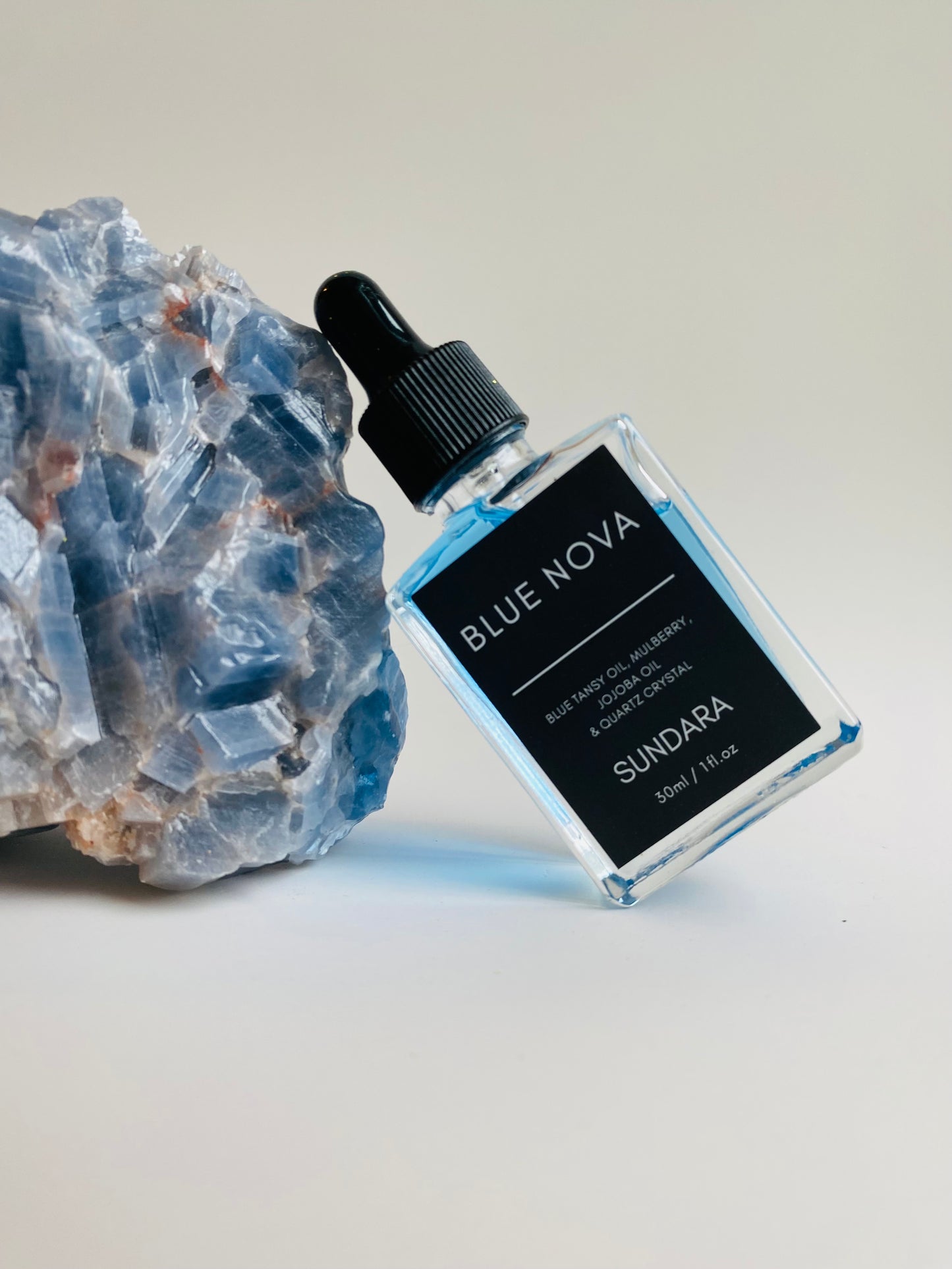 Blue Nova by Soul of sundara balancing on a quartz crystal