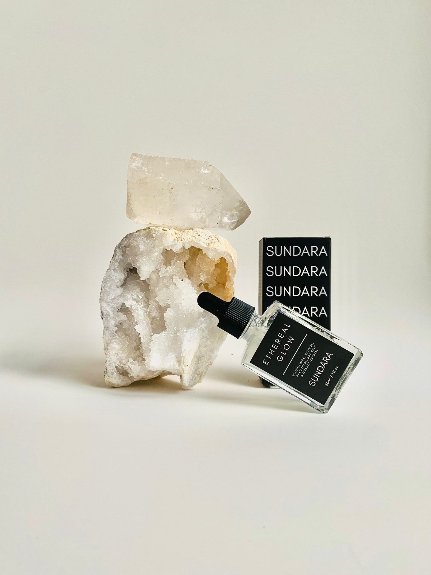 Soul of Sundara Ethereal Glow serum on a quartz crystal. Elasticity improving, collagen boosting serum for aging skin. All natural, scent free, plant based luxury skincare serum.